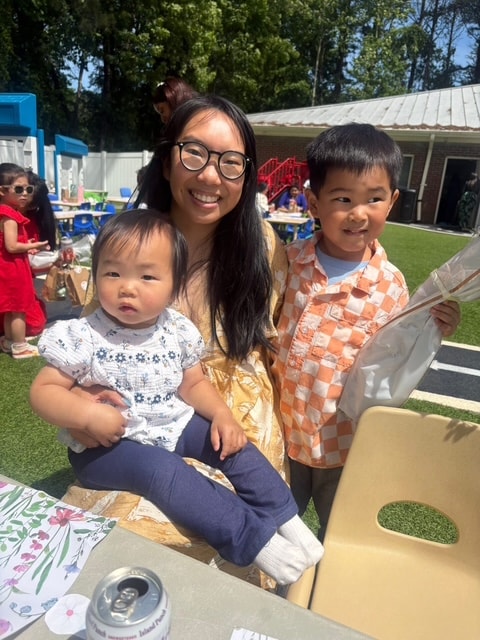 Family enjoying outdoor event at St. Peter's Academy