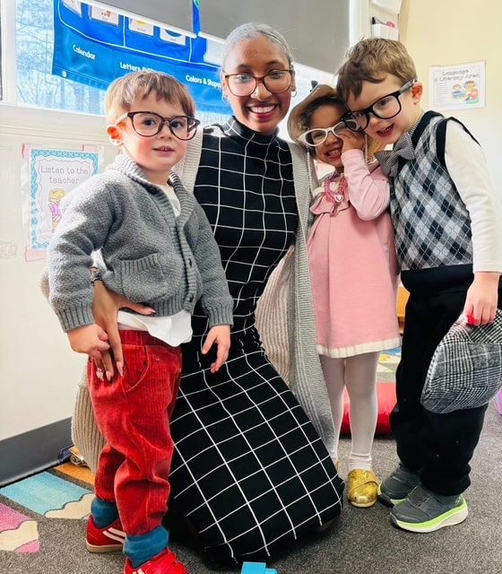 Teacher and students dressed up in classroom